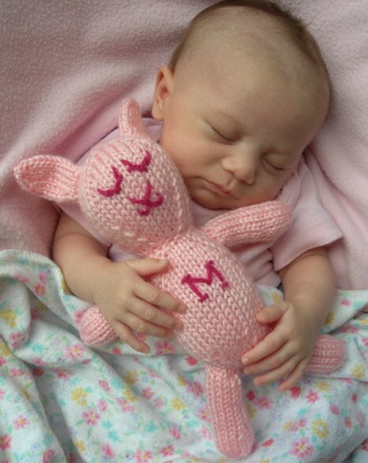 Sleeping her her bunny stuffed animal!