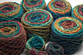 Noro Silk Garden in Color 228 wound into yarn cakes.