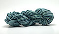 Extra bulky handspun teal yarn.