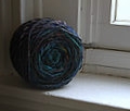 Noro Big Kureyon in color #12 in the form of a yarn cake. I know the window is a little icky...