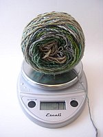 Weighing in.  My previous measurements showed that I used 67g for the increase sections of my Clapotis.  If I start decreasing now I should have just enough yarn, with very little leftovers.